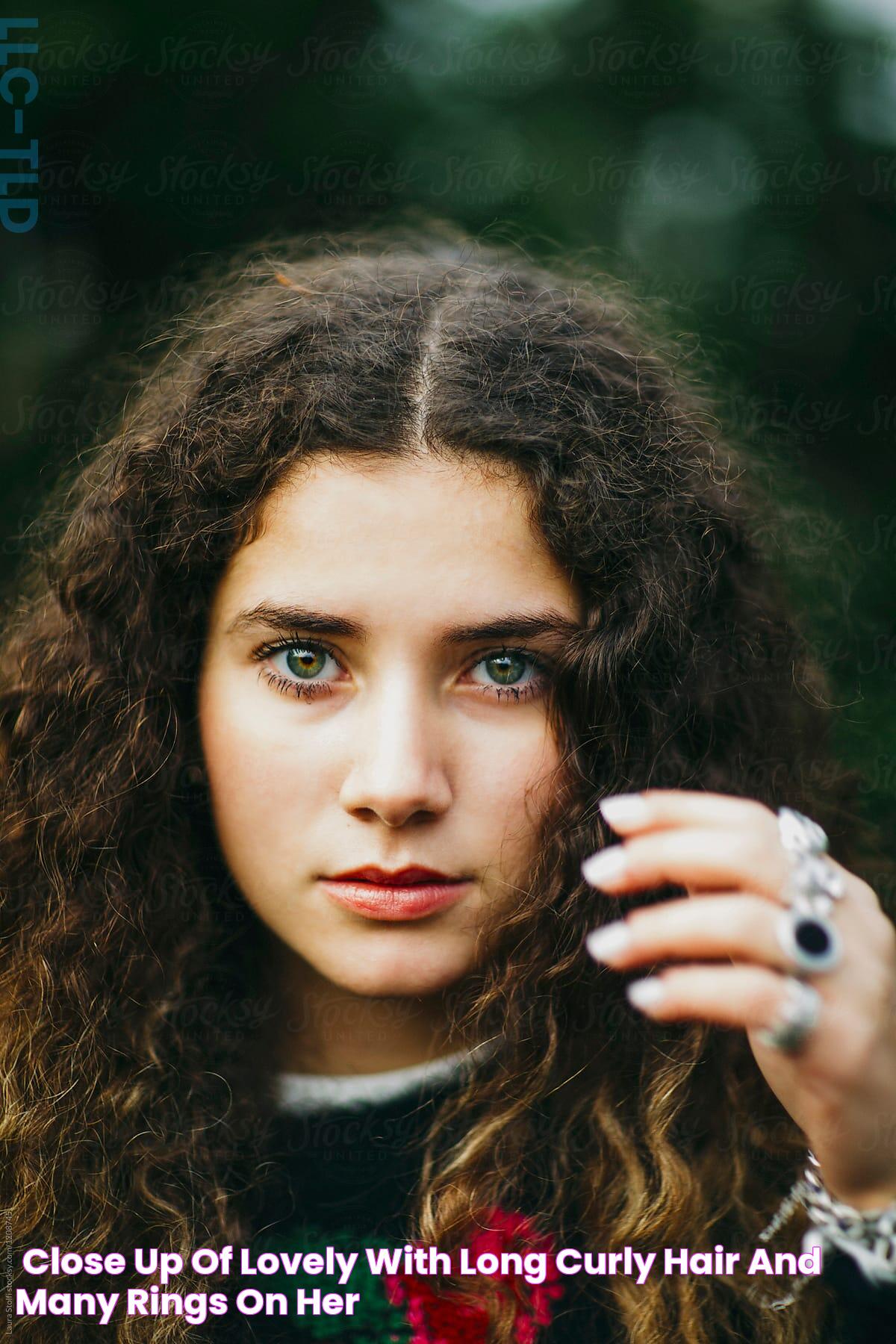 «Close Up Of Lovely With Long Curly Hair And Many Rings On Her