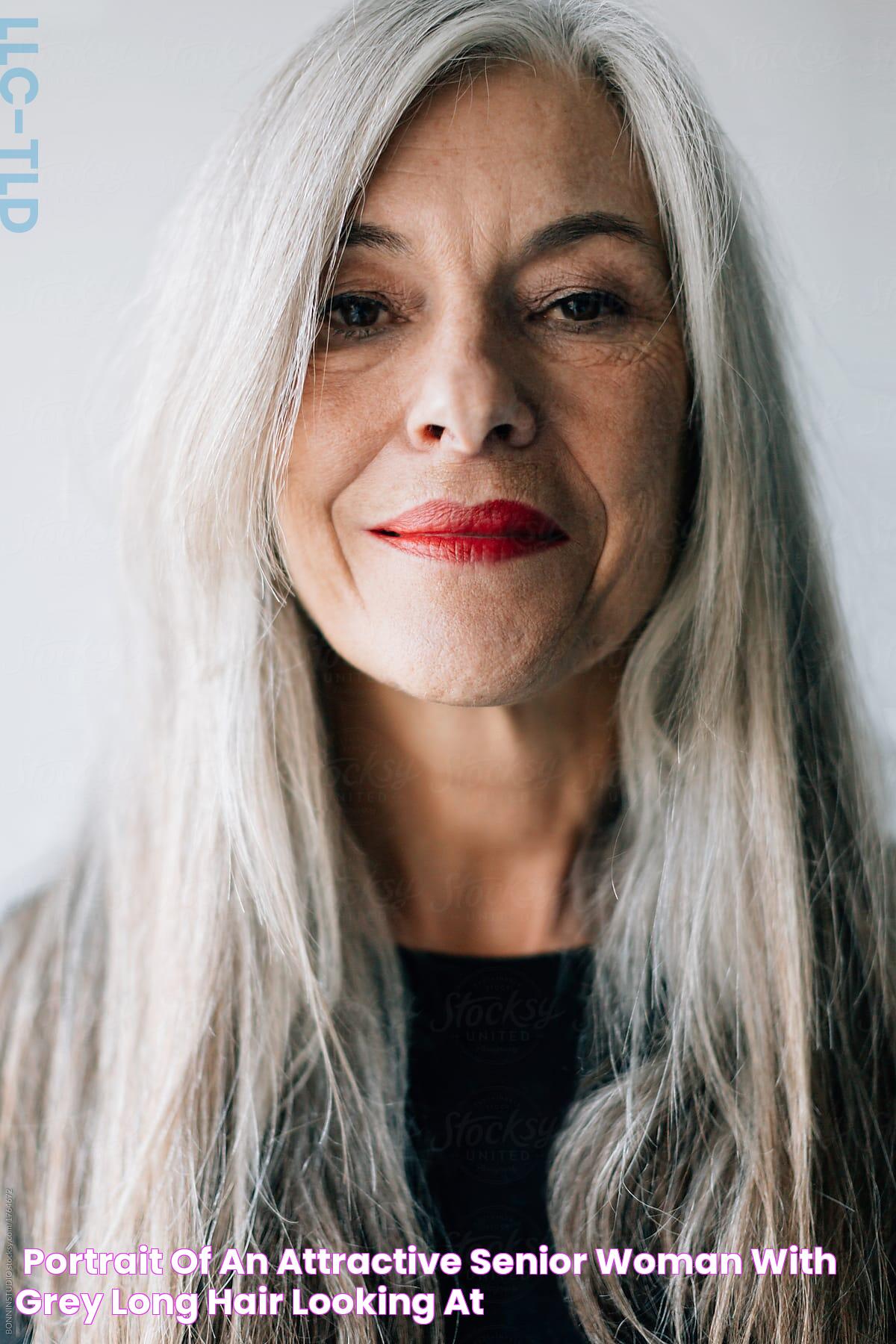 "Portrait Of An Attractive Senior Woman With Grey Long Hair Looking At